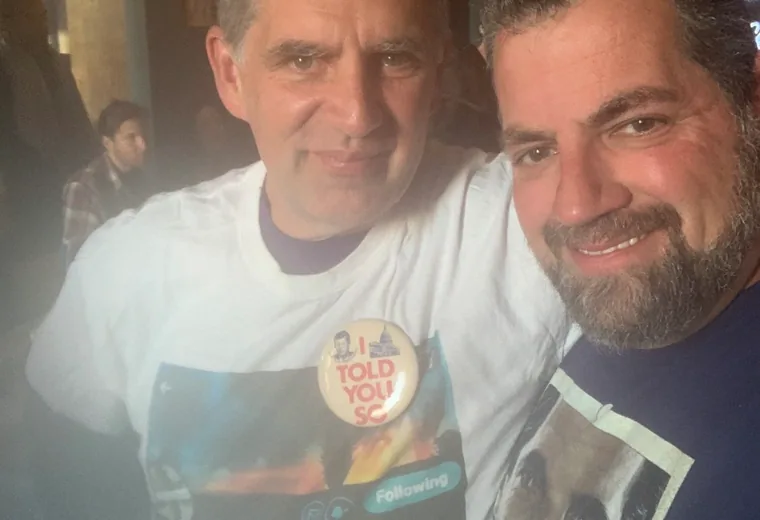 Two attendees taking an indoor selfie