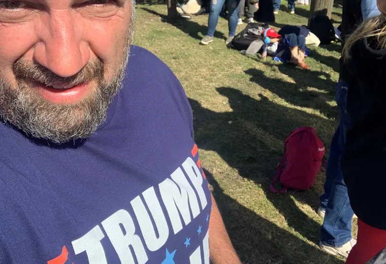 Outdoor selfie among a group of supporters