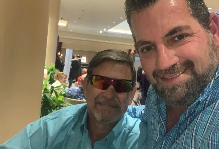Two attendees taking a selfie indoors
